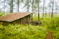 A beautiful small wooden building in the middle of Finnish forest Royalty Free Stock Photo