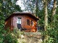 Beautiful small wooden house in the forest Royalty Free Stock Photo