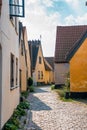 Beautiful, small, yellow rustic houses. Traditional Scandinavian style. Royalty Free Stock Photo