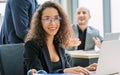 Beautiful smart Caucasian businesswoman wearing eyeglasses and formal suit, smiling with happiness and success, working and using Royalty Free Stock Photo