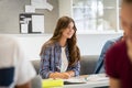 Beautiful smart girl listening lesson at high school Royalty Free Stock Photo