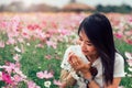 Beautiful smile asian woman in the cosmos field.Vintage Style Royalty Free Stock Photo