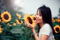 Beautiful smile asian woman in the sunflower field.Vintage Style Royalty Free Stock Photo