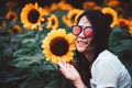 Beautiful smile asian woman with sunglasses in the sunflower field.Vintage Style Royalty Free Stock Photo