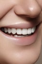 Beautiful smile with whitening teeth. Dental photo. Macro closeup of perfect female mouth, lipscare rutine