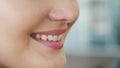 Beautiful smile with whitening teeth. Dental photo. Macro closeup of perfect female mouth, lipscare rutine. Happy