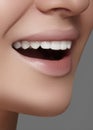 Beautiful smile with whitening teeth. Dental photo. Macro closeup of perfect female mouth, lipscare rutine