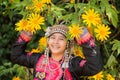 Beautiful smile young hill tribe girl in sunflowers garden. Royalty Free Stock Photo