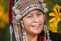 Beautiful smile young hill tribe girl in sunflowers garden. Royalty Free Stock Photo