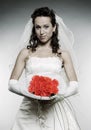 Beautiful smiley bride with bunch of flowers