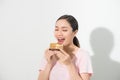 Beautiful smiling asian young woman with a chocolate cake isolated on white background Royalty Free Stock Photo