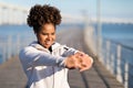 Beautiful Smiling Black Woman Stretching Arms Before Training Outdoors Royalty Free Stock Photo