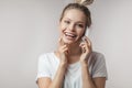 Beautiful smiling blond woman talking by cell mobile phone. Closeup. Isolated. Royalty Free Stock Photo