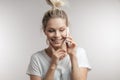 Beautiful smiling blond woman talking by cell mobile phone. Closeup. Isolated. Royalty Free Stock Photo