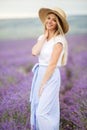 Beautiful smiling blonde girl on the lavender field, summer time Royalty Free Stock Photo