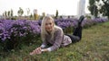 Beautiful smiling blonde woman in woolen sweater in autumn park Royalty Free Stock Photo