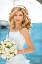 Beautiful smiling bride girl in wedding dress with white umbrell Royalty Free Stock Photo