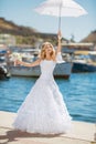 Beautiful smiling bride girl in wedding dress with white umbrell Royalty Free Stock Photo