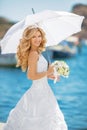 Beautiful smiling bride girl in wedding dress with white umbrell Royalty Free Stock Photo