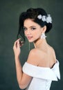Beautiful smiling bride with wedding makeup and fashion hairstyle. Gorgeous young woman in a white dress with jewelry in her hair Royalty Free Stock Photo