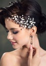 Beautiful smiling bride with wedding makeup and hairstyle. Gorgeous young woman with jewelry in her hair Royalty Free Stock Photo