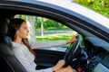 Beautiful smiling brunette girl behind the wheel of a car Royalty Free Stock Photo