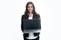 Beautiful smiling business woman over grey background using laptop computer. Woman holding laptop with empty mock up