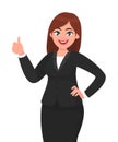 Beautiful smiling business woman showing thumbs up sign / gesture. Like, agree, approve, positive. Royalty Free Stock Photo