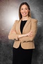 Beautiful smiling businesswoman arms folded standing