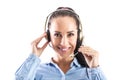 Beautiful smiling call centre worker with headset with microphone smiling into the camera Royalty Free Stock Photo