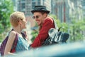 beautiful smiling couple with backpacks