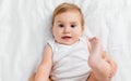 Beautiful smiling cute baby. Close up portrait of happy lying baby looking at camera Royalty Free Stock Photo