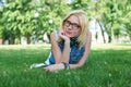 Beautiful smiling dark-haired young woman lying Royalty Free Stock Photo