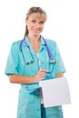 Beautiful smiling female doctor with ballpoint pen and clipboard Royalty Free Stock Photo