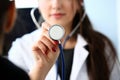 Beautiful smiling female doctor hold in arm Royalty Free Stock Photo