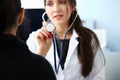 Beautiful smiling female doctor hold in arm Royalty Free Stock Photo