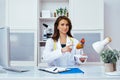beautiful smiling female doctor in office showing human heart mockup Royalty Free Stock Photo