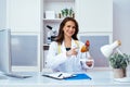 beautiful smiling female doctor in office showing human heart mockup Royalty Free Stock Photo