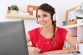 Beautiful smiling female student using online education service Royalty Free Stock Photo