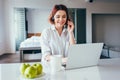 Beautiful smiling freelancer with apples and