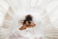 Beautiful smiling girl awakening in white bed. Happy wake up and start new day Royalty Free Stock Photo