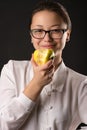 Beautiful smiling girl eating green apple Royalty Free Stock Photo