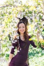 Beautiful smiling girl in magnolia flowers