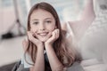 Beautiful smiling girl relaxing on the floor