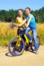 Beautiful smiling girls ride bicycle