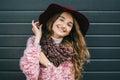 Beautiful smiling happy woman in hat. Retro fashion. Summer hat with large brim over dark blue background Royalty Free Stock Photo