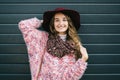 Beautiful smiling happy woman in hat. Retro fashion. Summer hat with large brim over dark blue background Royalty Free Stock Photo