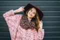 Beautiful smiling happy woman in hat. Retro fashion. Summer hat with large brim over dark blue background Royalty Free Stock Photo