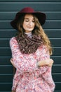 Beautiful smiling happy woman in hat. Retro fashion. Summer hat with large brim over dark blue background Royalty Free Stock Photo