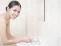 A beautiful woman is washing her face Royalty Free Stock Photo
